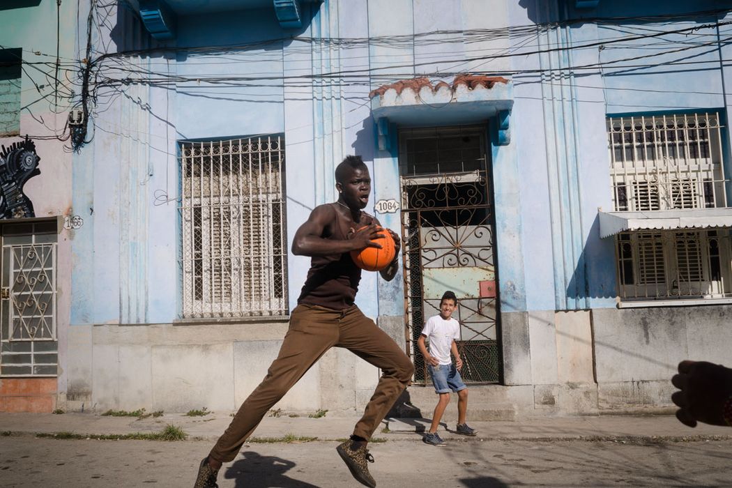 young cuban man jumping in havana