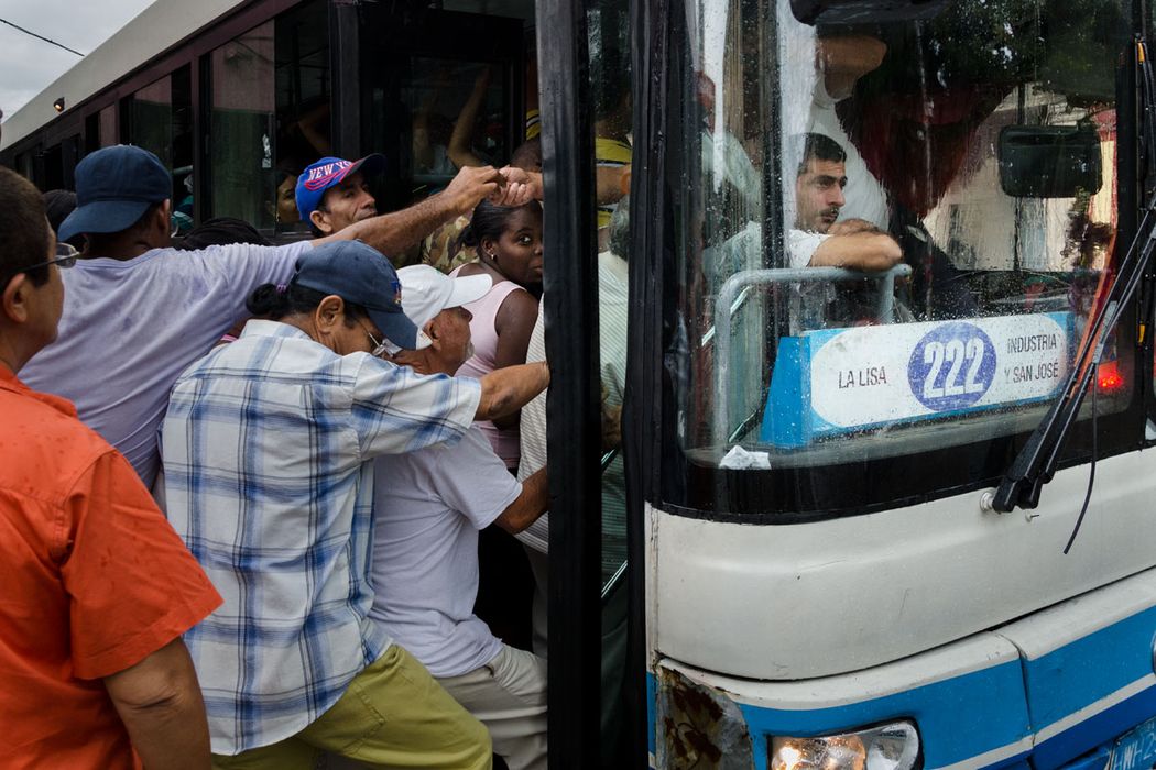 cuban people going in a national bus