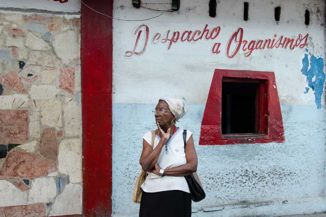 old cuban woman waiting in a store
