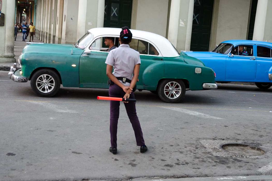 young cuban woman police