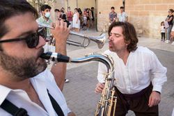 saxophone man and public in out photographic holidays in spain