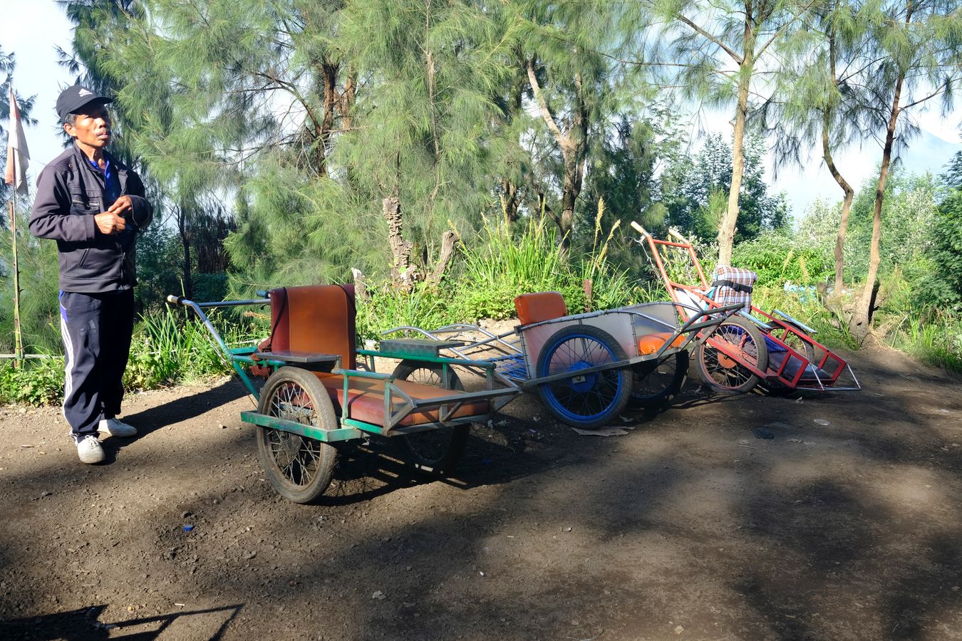 A wheelbarrow porter waits for customers on the way down from Ijen volcano