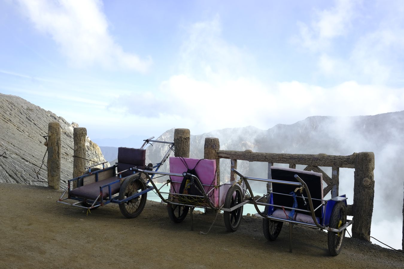 Wheelbarrows parked at the summit of Ijen volcano 