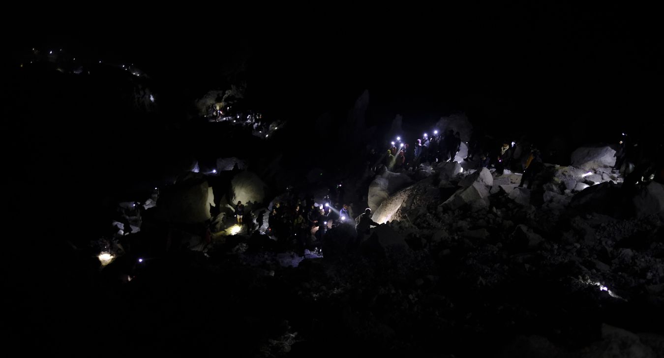 Tourists descending into the crater of Ijen volcano