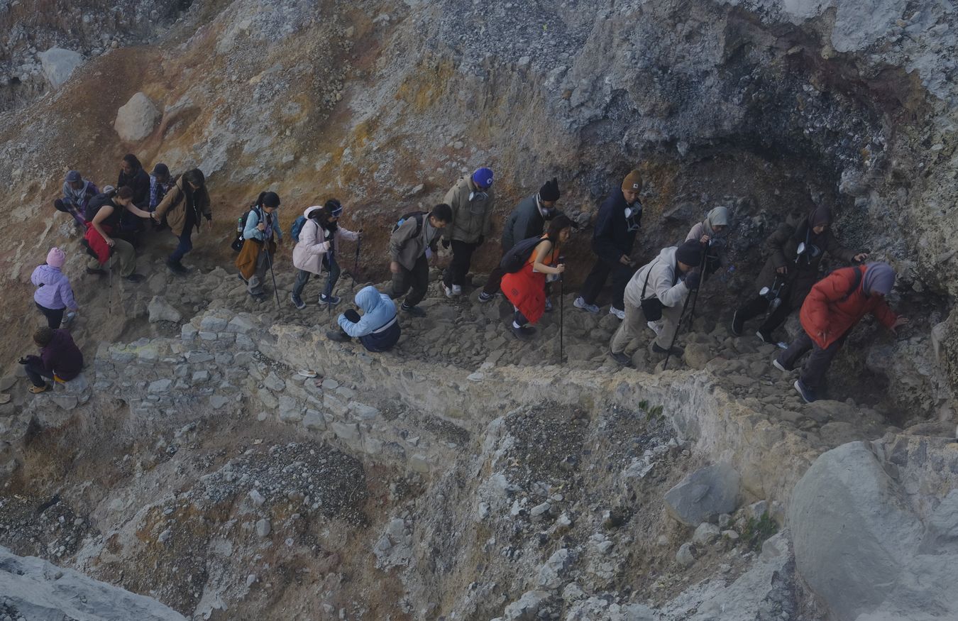 Tourists ascending from the crater of Ijen volcano