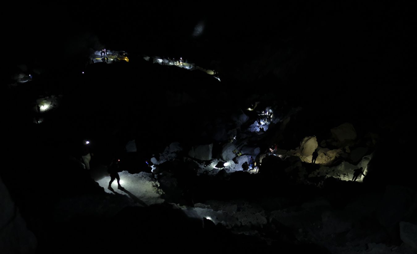 Visitors descend into the crater of Ijen volcano