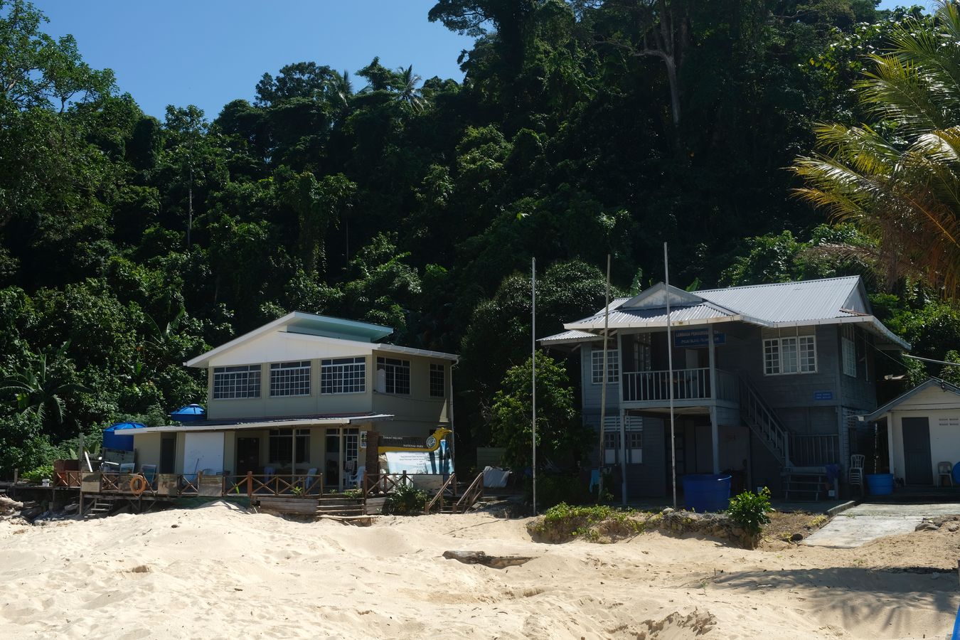 House for LPP workers { right } and house for visitors { left }