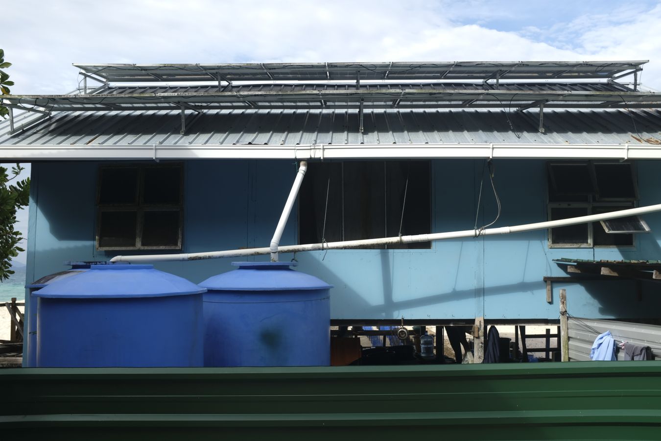 Solar panels and pipes for collecting rainwater in the rangers house. 