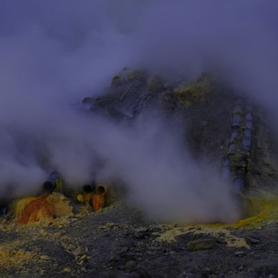 Smoke rising from the chimneys in the caldera of Ijen volcano