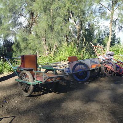 A wheelbarrow porter waits for customers on the way down from Ijen volcano