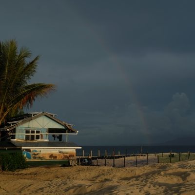 View of the sea turtle hatchery and the rangers house on a stormy afternoon with rainbows.