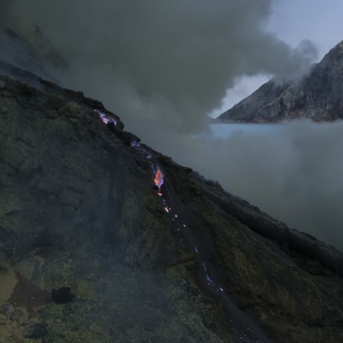 Dawn breaks over the caldera of the Ijen volcano