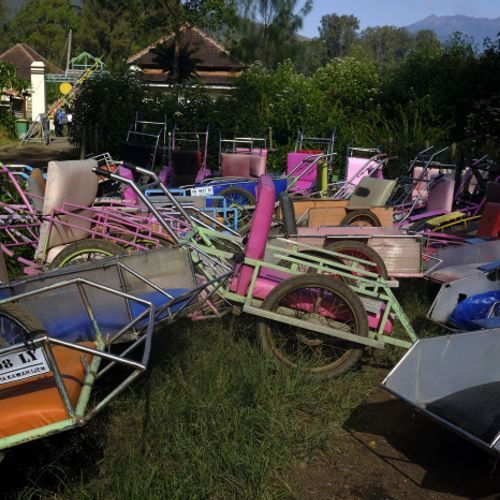 Wheelbarrows for transporting tourist parked at the start of the climbs th the Ijen volcano