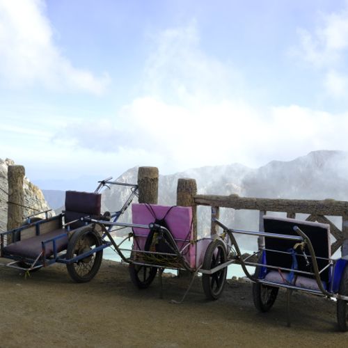 Wheelbarrows parked at the summit of Ijen volcano 