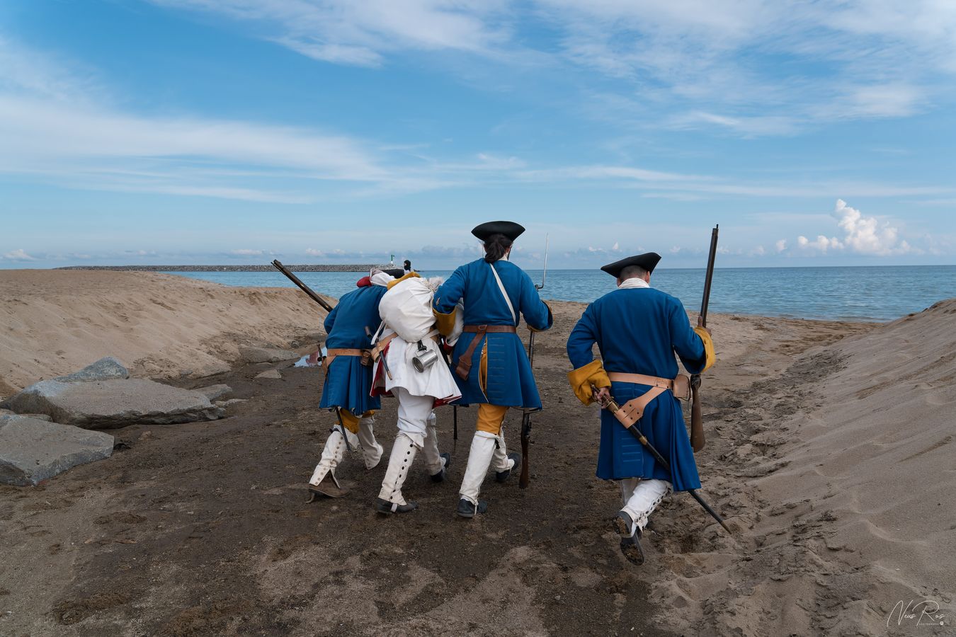 The soldiers carry the wounded man