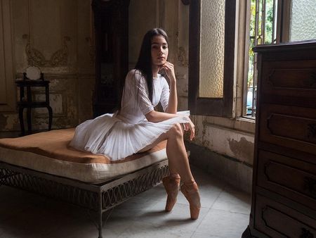 young beautiful cuban woman in a colonial house