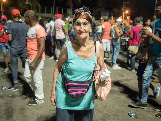 old cuban lady in carnivals, cuban street photo