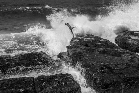jumping against a wave in Cuba, cuban photography