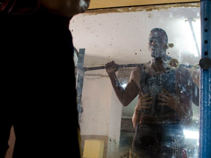 cuban strong man training in a gym , cuban photo