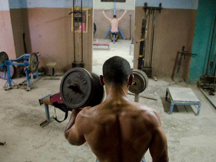muscles of cuban men in a havana´s gym