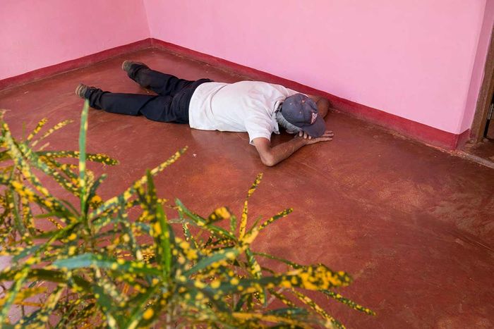 old cuban man resting on the floor