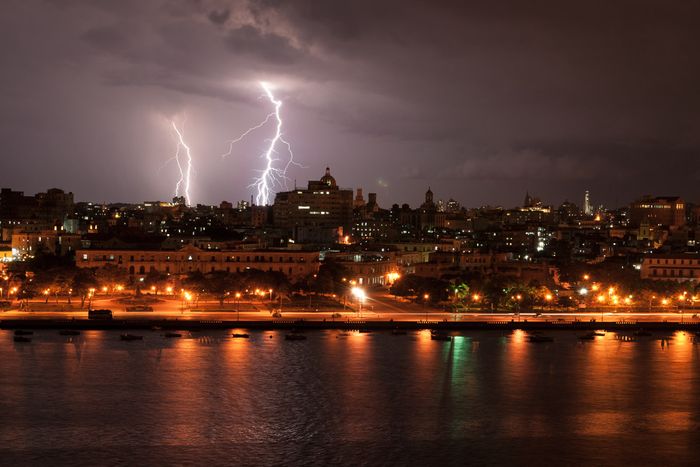rays and storm in havana city, by louis alarcon