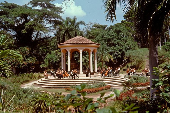 Temple in the middle of a park where a Cuban orchestra encourages people in Cuba in the 50s