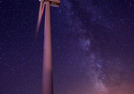 Wind turbine and Milky Way. Eolic energy